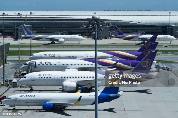 Thai Airways International aircraft are grounded after flight operations were suspended at Suvarnabhumi Airport in Samut Prakan province, Thailand,...