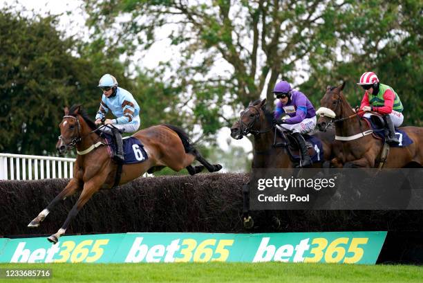 Statuario ridden by James Bowen clears a hurdle whilst competing in the bet365 Handicap Chase at Uttoxeter Racecourse on June 27, 2021 in Uttoxeter,...