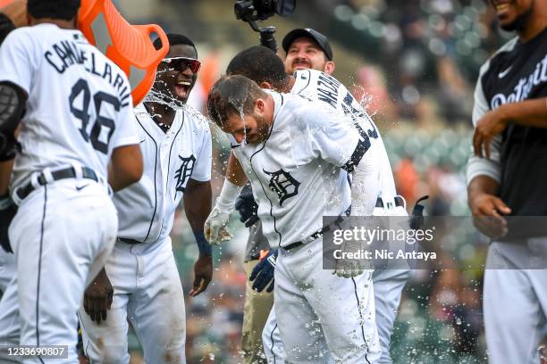 The Detroit Tigers celebrate their win against the Houston Astros by pouring water on Robbie Grossman of the Detroit Tigers during the bottom of the...