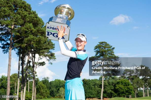 Women's PGA Champion Nelly Korda poses with the KPMG trophy after the final round for the 2021 KPMG Women's Championship at the Atlanta Athletic Club...
