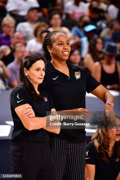 Coaches, Sandy Brondello and Chasity Melvin of the Phoenix Mercury smile during the game against the Los Angeles Sparks on June 27, 2021 at Phoenix...