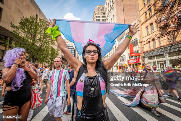 Participant carrying a Trans Flag seen at the march. Thousands of New Yorkers took to the streets of Manhattan to participate on the Reclaim Pride...