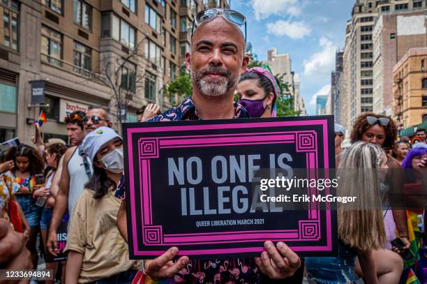 Participant seen holding a sign at the march. Thousands of New Yorkers took to the streets of Manhattan to participate on the Reclaim Pride...