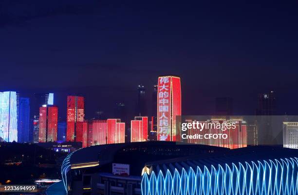 Light show featuring the centenary of the founding of the Communist Party of China is staged in more than 60 buildings in Jinan, Shandong Province,...