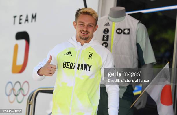 June 2021, Bavaria, Munich: Track and field athlete Yannick Wolf wears a new top while dressing part of the German Olympic team. Photo: Angelika...