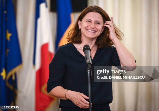 French Sports Minister Roxana Maracineanu answers journalists' questions during a press conference at the French Embassy to Romania in Bucharest June...