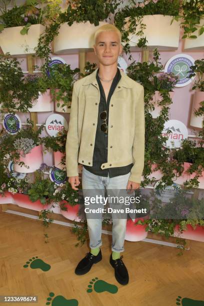 Romeo Beckham poses in evian's VIP suite, certified as carbon neutral by The Carbon Trust, during day one of The Championships, Wimbledon 2021 on...