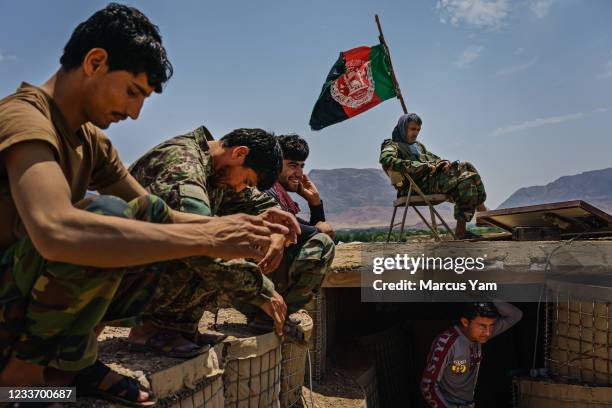 Soldiers pass time at an Afghan National Army base in Arghandab District, Afghanistan, Tuesday, May 4, 2021. Arghandab, a district lush with fruit...