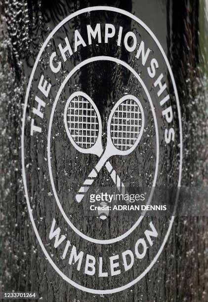 The Wimbledon logo is pictured in a water fountain on the first day of the 2021 Wimbledon Championships at the The All England Tennis Club in...