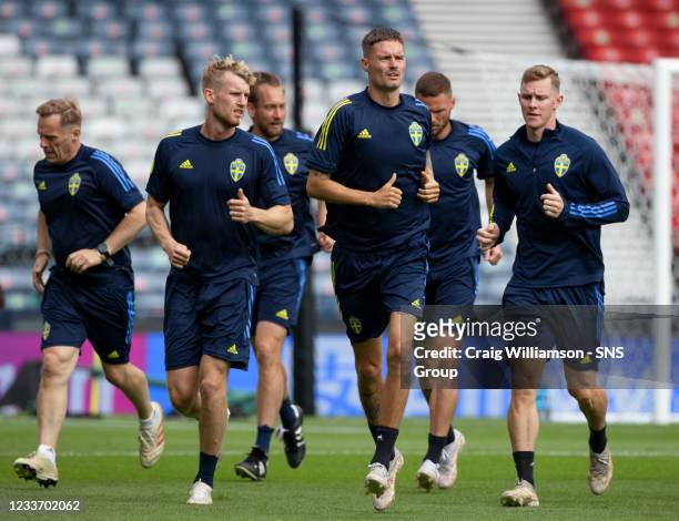 Mikael Lustg and Filip Helander are pictured as the Sweden national side train ahead of a Euro 2020 last 16 match against Ukraine at Hampden Park, on...