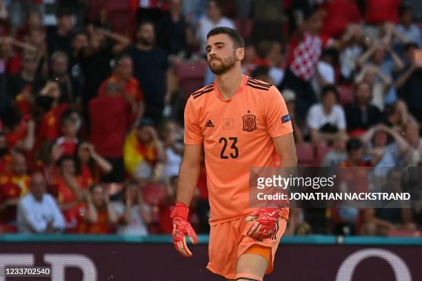 Spain's goalkeeper Unai Simon reacts to Spain's owngoal during the UEFA EURO 2020 round of 16 football match between Croatia and Spain at the Parken...