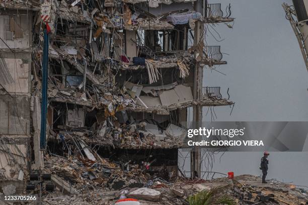 Search and Rescue teams look for possible survivors in the partially collapsed 12-story Champlain Towers South condo building on June 28, 2021 in...