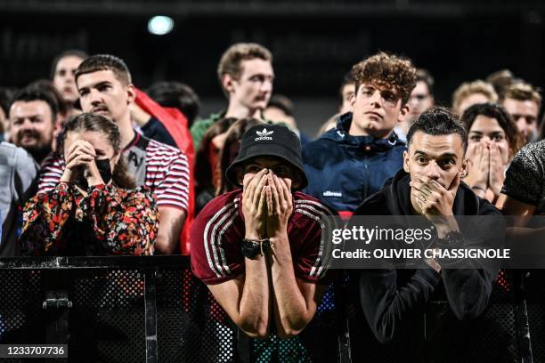 France's supporters react during the broadcast of the UEFA EURO 2020 round of 16 football match between France and Switzerland in a fan zone set up...