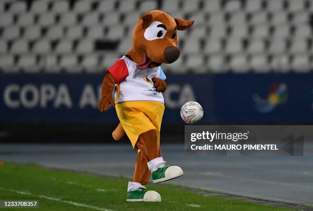 Copa America's mascot Pibe plays with a ball before the start of the Conmebol Copa America 2021 football tournament group phase match between Uruguay...
