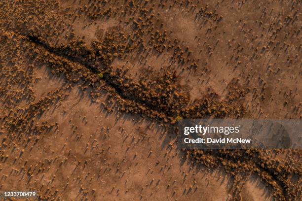 In an aerial view, polygonal blocks of giant desiccation cracks , as geologists have dubbed them, are seen near Red Lake on June 28, 2021 north of...