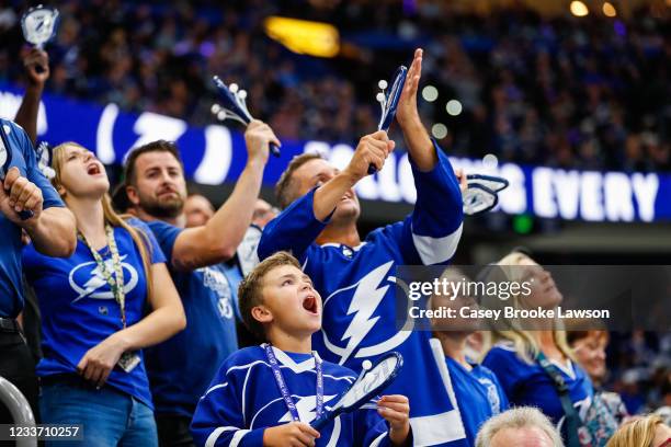 Fans of the Tampa Bay Lightning celebrate against the Montreal Canadiens in Game One of the Stanley Cup Final of the 2021 Stanley Cup Playoffs at...