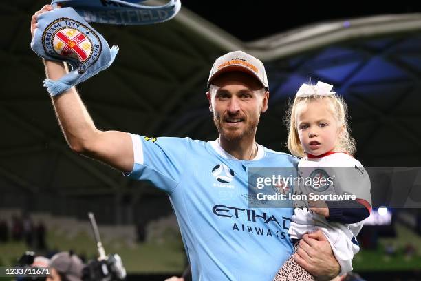 Rostyn Griffiths of Melbourne City carries his daughter onto the field during the A-League Grand-Final soccer match between Melbourne City FC and...