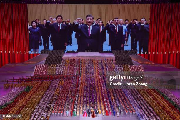 Large screen showing communist leader and Chinese President Xi Jinping during the art performance celebrating the 100th anniversary of the Founding...