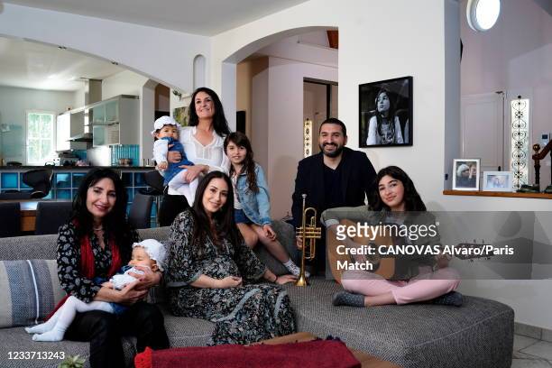 Trumpet player Ibrahim Maalouf is photographed at home with his family: Nada, his mother, Hiba Tawaji his wife, Layla his sister with her children...