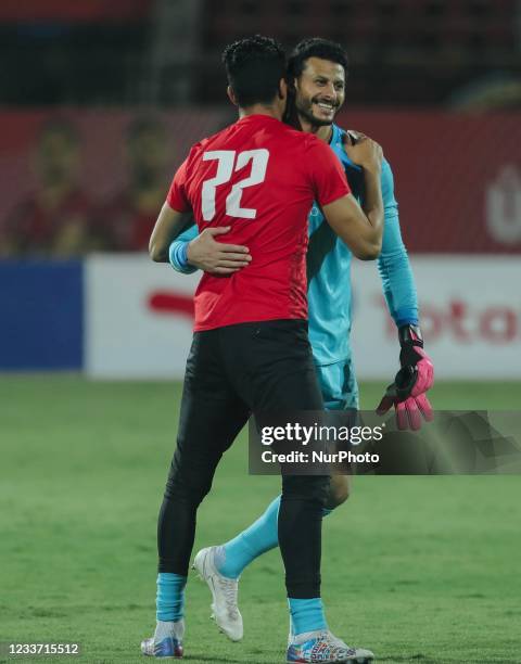 Ahly's Mohamed el Shenawy celebrate with ali lotfy during the second leg CAF champions league semi-final football match between Esperance and al-Ahly...