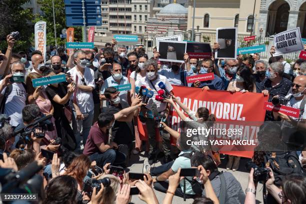 Photographer Bulent Kilic addresses the media as protesters hold signs reading 'we can't breath', during a demonstration near the Governor's Mansion...