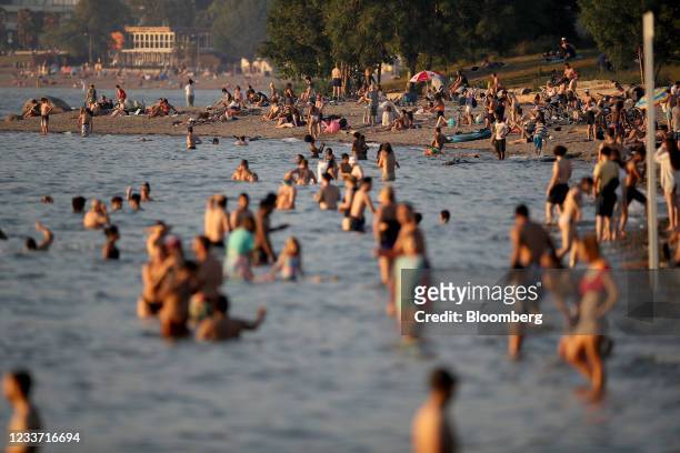 Beachgoers on Kitsilano Beach during a heatwave in Vancouver, British Columbia, Canada, on Monday, June 28, 2021. The heat is expected to continue...