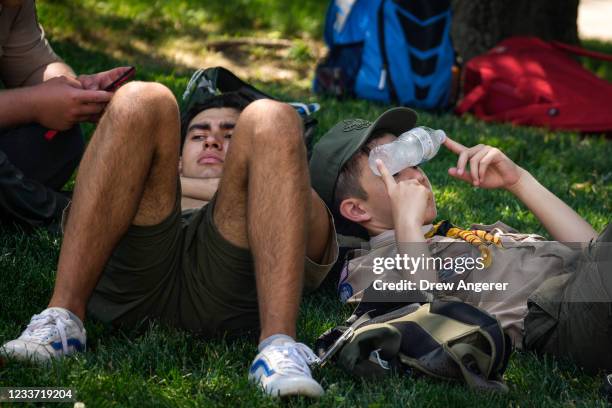 Boy Scouts cool off in the shade on the National Mall June 29, 2021 in Washington, DC. Temperatures will climb into the mid 90s in Washington on...