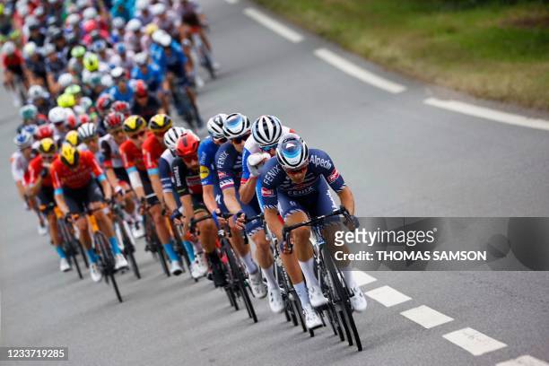 The pack rides during the 4th stage of the 108th edition of the Tour de France cycling race, 150 km between Redon and Fougeres, on June 29, 2021.