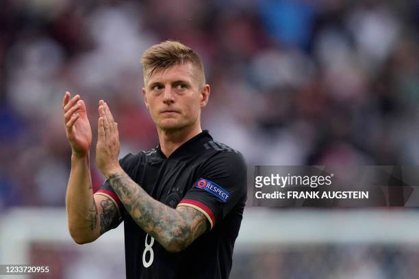 Germany's midfielder Toni Kroos applauds at the end of the UEFA EURO 2020 round of 16 football match between England and Germany at Wembley Stadium...