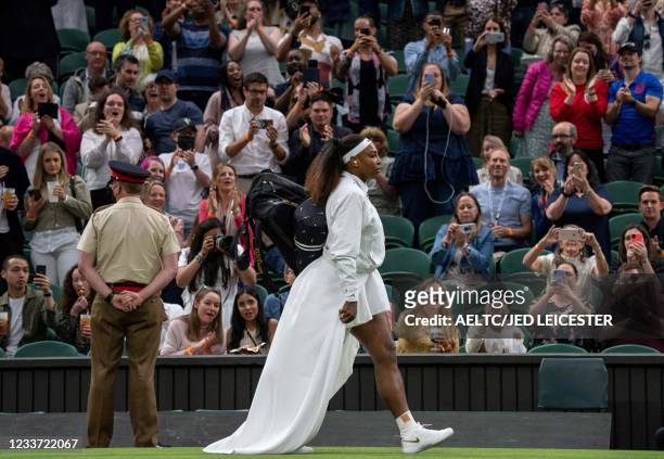 Player Serena Williams arrives on court to play against Belarus's Aliaksandra Sasnovich during their women's singles first round match on the second...