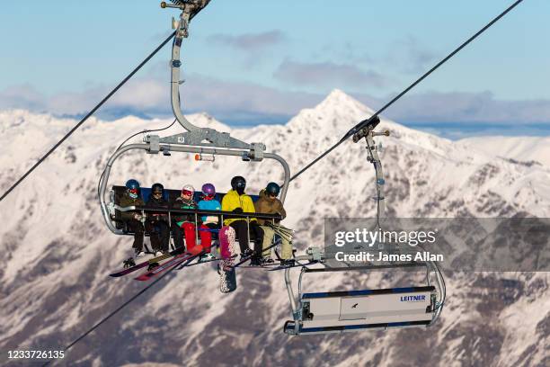 Guests on the Coronet Express Chairlift at Coronet Peak on June 30, 2021 in Queenstown, New Zealand. New Zealand has paused its quarantine-free...
