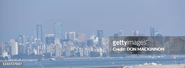 The city of Vancouver, British Columbia, is seen through a haze on a scorching hot day, June 29, 2021. - Schools and Covid-19 vaccination centers...