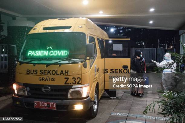 Covid-19 patients arrive at Wisma Atlet Covid-19 Emergency Hospital to undergo quarantine. Indonesia has seen a significant spike in COVID-19 cases,...