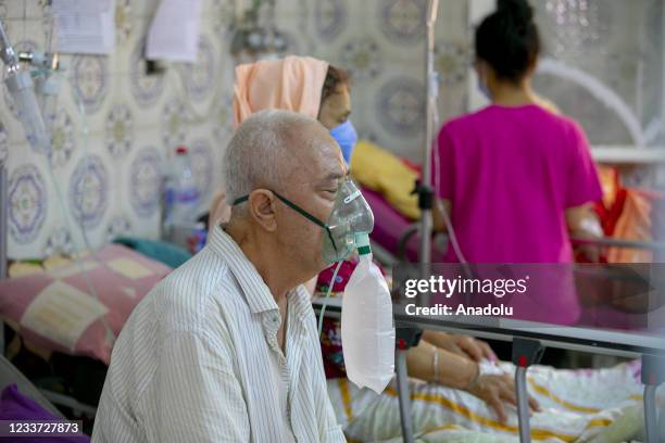 Patients are seen during their treatment process at the intensive care unit of the Ibn Jarrah hospital as the quarantine process continue in Siliana,...