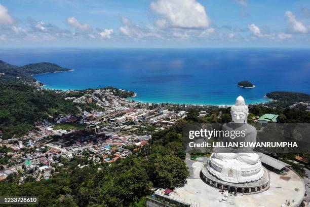 An aerial photograph of the Big Buddha and Kata Beach behind it on June 30 a day before the Phuket Sandbox tourism scheme that allows visits by...