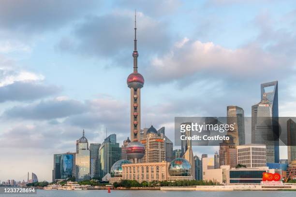 Photo taken on June 29, 2021 shows landmarks such as the Oriental Pearl Tower and Shanghai Tower at Lujiazui on the Bund in Shanghai, China.
