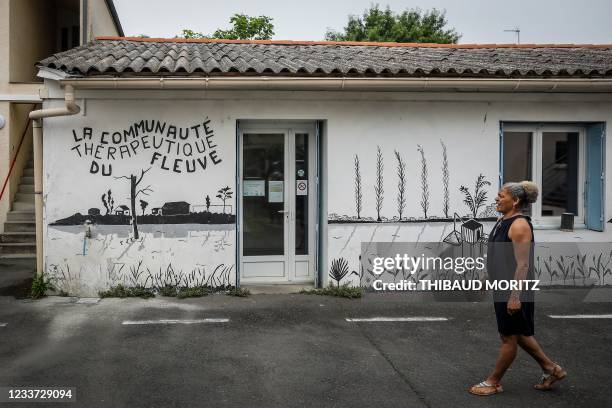 In this photograph taken on June 17 'Sylvie', a former crack addict walks in the grounds of "Centre de soins, d'accompagnement et de prevention en...