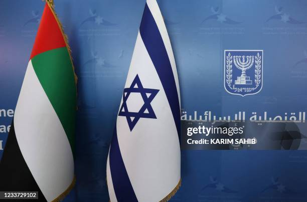 The national flags of the United Arab Emirates and Israel, are set side by side at the new Israeli consulate of Dubai, ahead of a press conference by...
