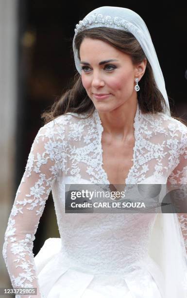 Kate, Duchess of Cambridge, comes out of Westminster Abbey, with her husband Britain's Prince William following their wedding ceremony, in central...