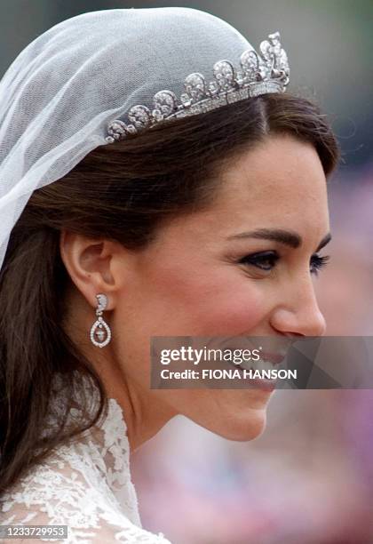 Kate, the Duchess of Cambridge, smiles prior to departing Westminster Abbey in London after her wedding to Britain's Prince William on April 29,...