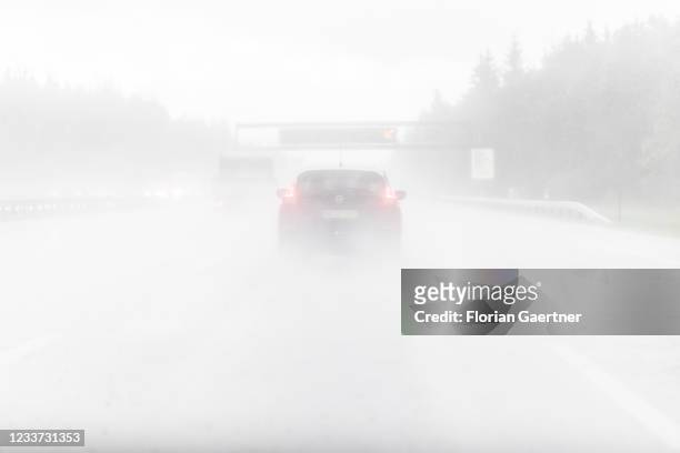 Cars on the highway A8 are pictured during heavy rain near Munich on June 29, 2021 in Munich, Germany.
