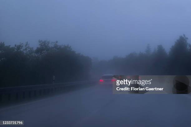 Cars on the highway A8 are pictured during heavy rain near Munich on June 29, 2021 in Munich, Germany.