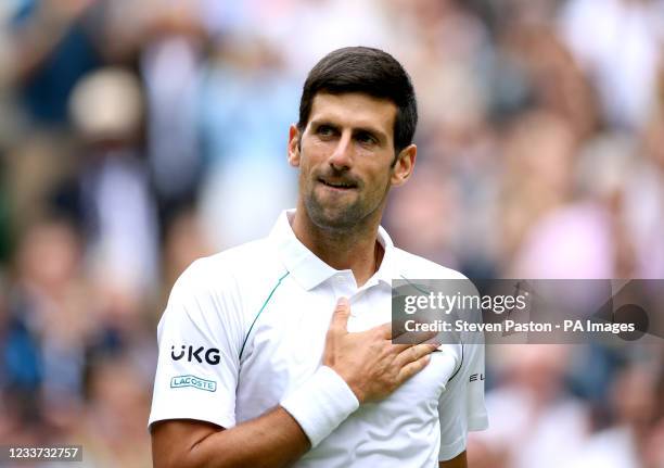 Novak Djokovic celebrates winning his second round gentlemen's singles match against Kevin Anderson on centre court on day three of Wimbledon at The...