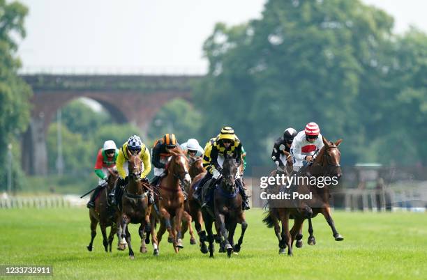 Runners and riders in action in the Sky Sports Racing Sky 415 Mares' Open NH Flat Race at Worcester Racecourse on June 30, 2021 in Worcester, England.