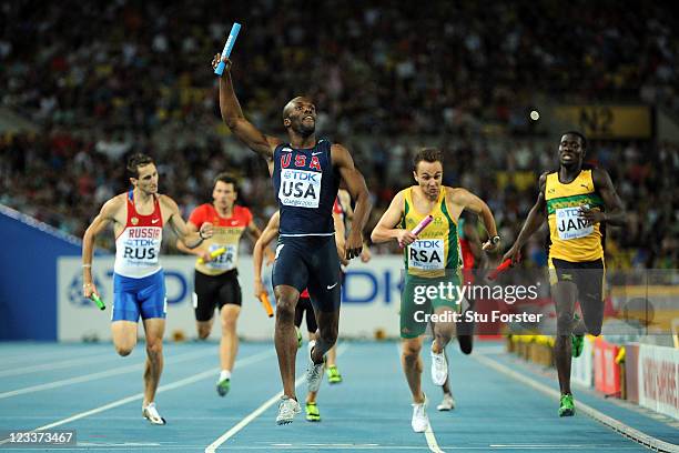 LaShawn Merritt of the USA crosses the finish line ahead of L.J. Van Zyl of South Africa to claim victory in the men's 4x400 metres relay final...