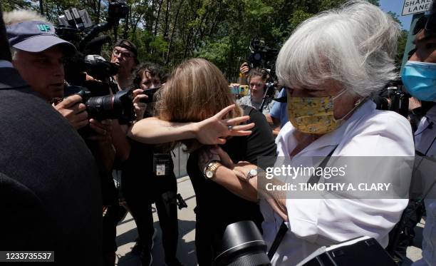 German-born American TV actress Allison Mack leaves Brooklyn Federal Court on June 30, 2021 in New York, after being sentenced for three years, for...