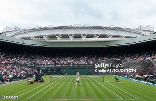General view of play on Centre Court, with the roof open, as Britain's Katie Boulter plays against Belarus's Aryna Sabalenka during their women's...