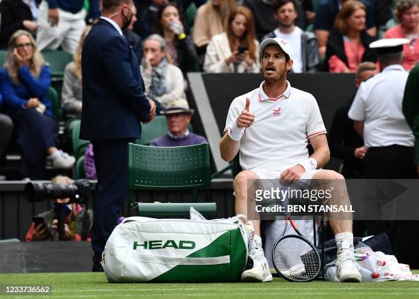 Britain's Andy Murray signals to his bench during his match against Germany's Oscar Otte during their men's singles second round match on the third...