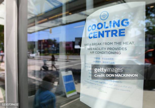 Welcoming sign is seen on the door of the Hillcrest Community Centre where they can cool off during the extreme hot weather in Vancouver, British...