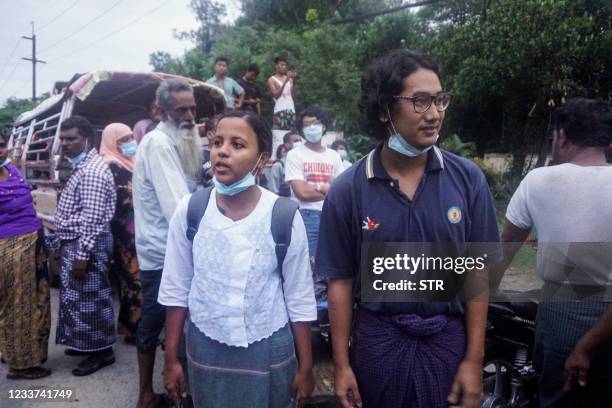 This photo taken on June 30, 2021 shows Myanmar Pressphoto Agency journalist Ye Myo Khant and Myanmar Now photographer Kay Zone Nway posing after...